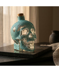 Sales energéticas con botella de cráneo decorada con cristales azul agua