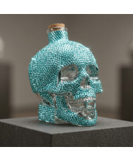 Sales energéticas con botella de cráneo decorada con cristales azul agua
